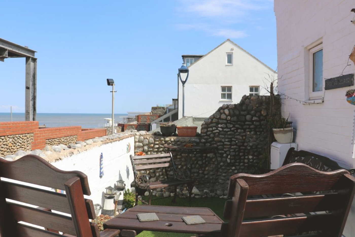 The terrace at Splashpoint, with seating and a view towards the sea